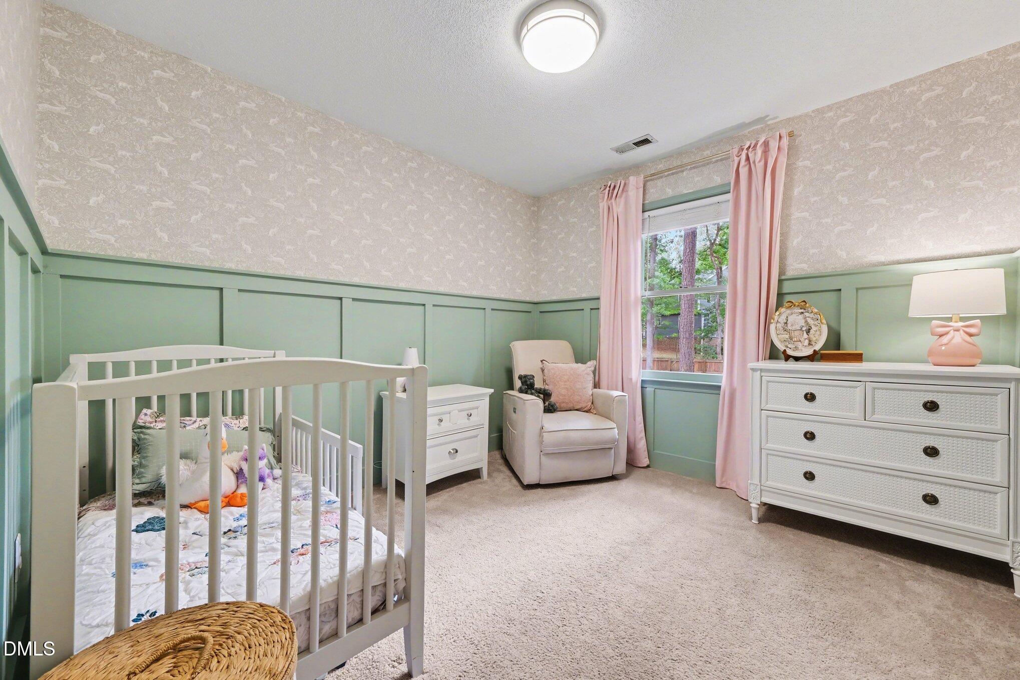 103 Leckford Way Cary, NC 27513 - Photo 20 of 49 a bedroom with furniture and white walls