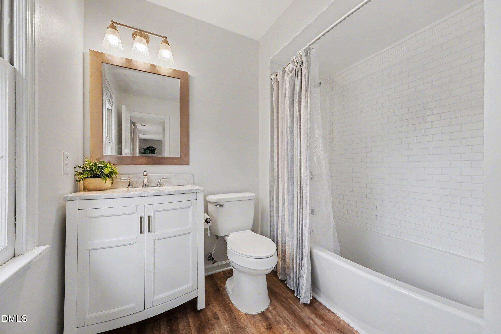 103 Leckford Way Cary, NC 27513 - Photo 29 of 49 a bathroom with a sink a toilet and shower