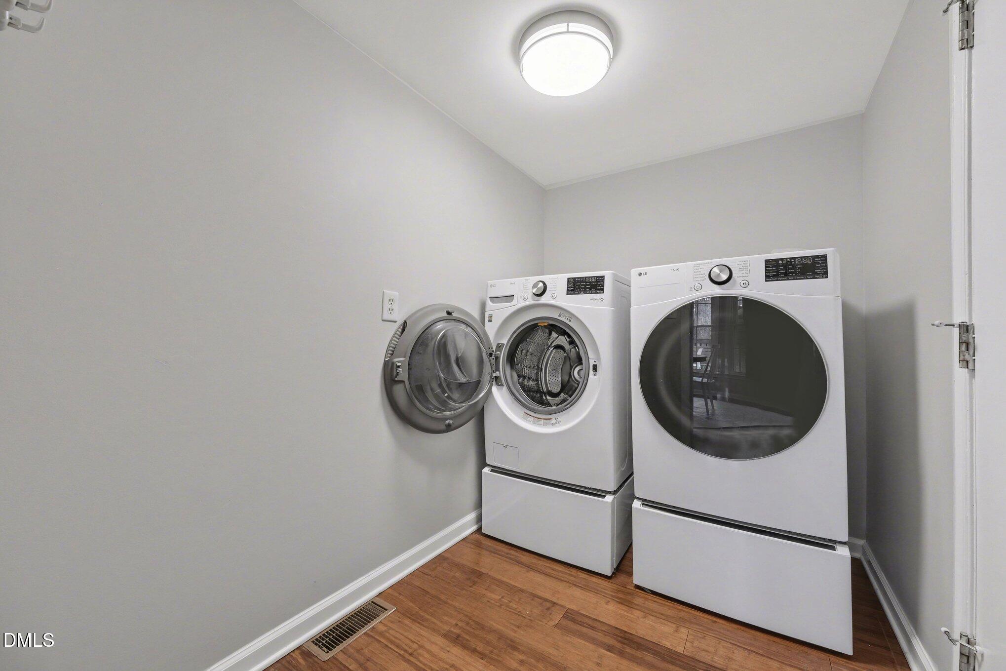 103 Leckford Way Cary, NC 27513 - Photo 31 of 49 a utility room with dryer and washer