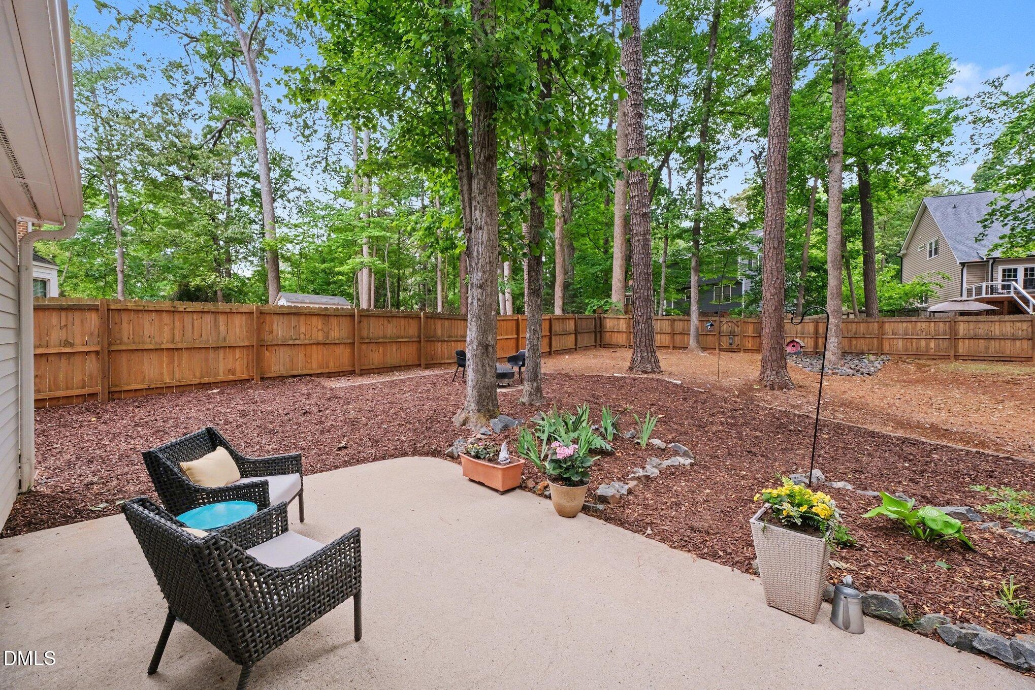 103 Leckford Way Cary, NC 27513 - Photo 32 of 49 a view of a bench in the garden