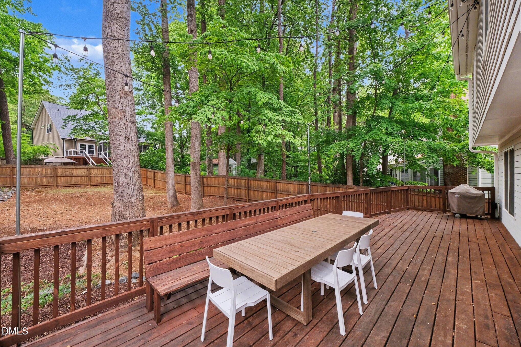 103 Leckford Way Cary, NC 27513 - Photo 35 of 49 a view of backyard with a patio and wooden floor