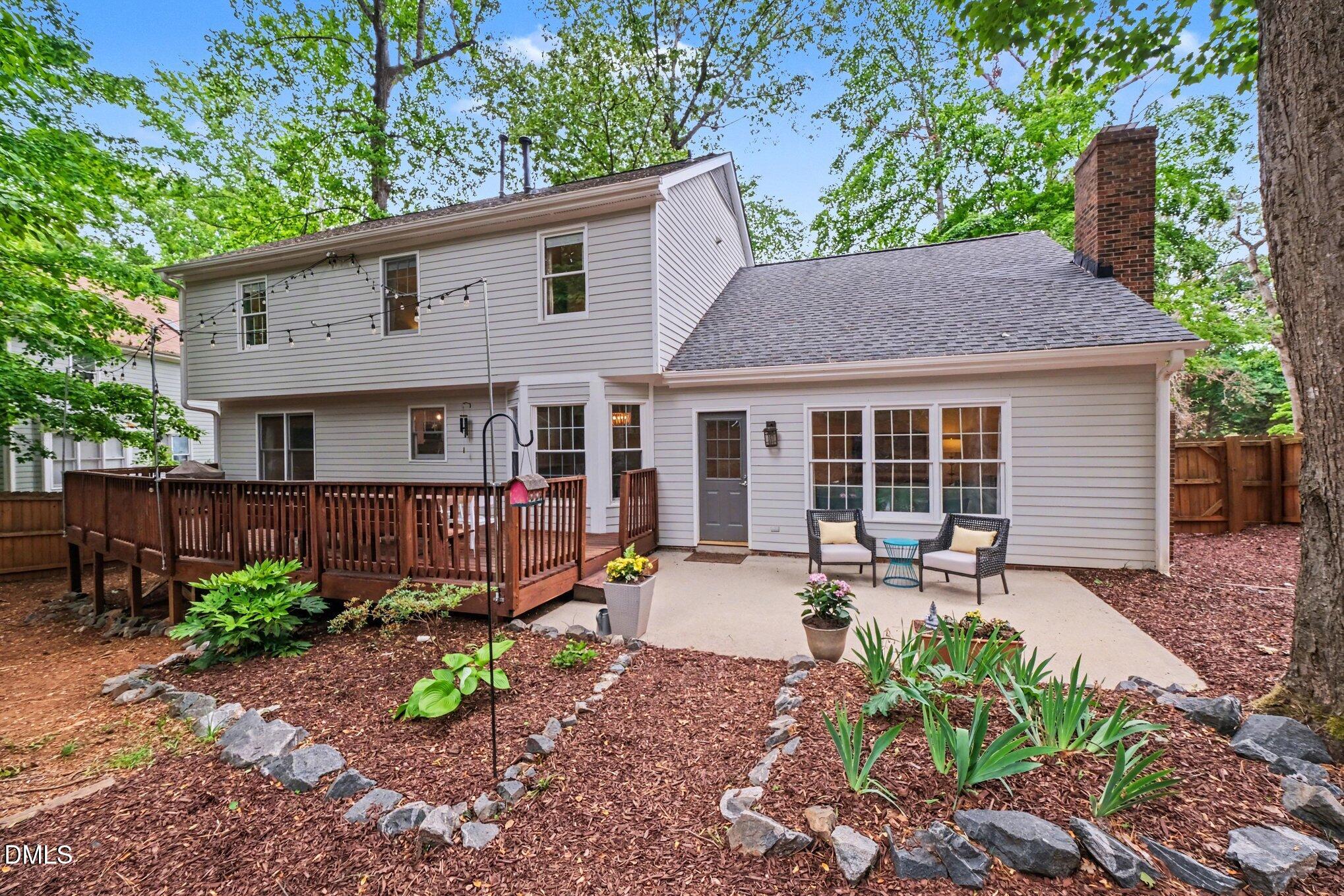 103 Leckford Way Cary, NC 27513 - Photo 37 of 49 a view of a house with a yard and sitting area