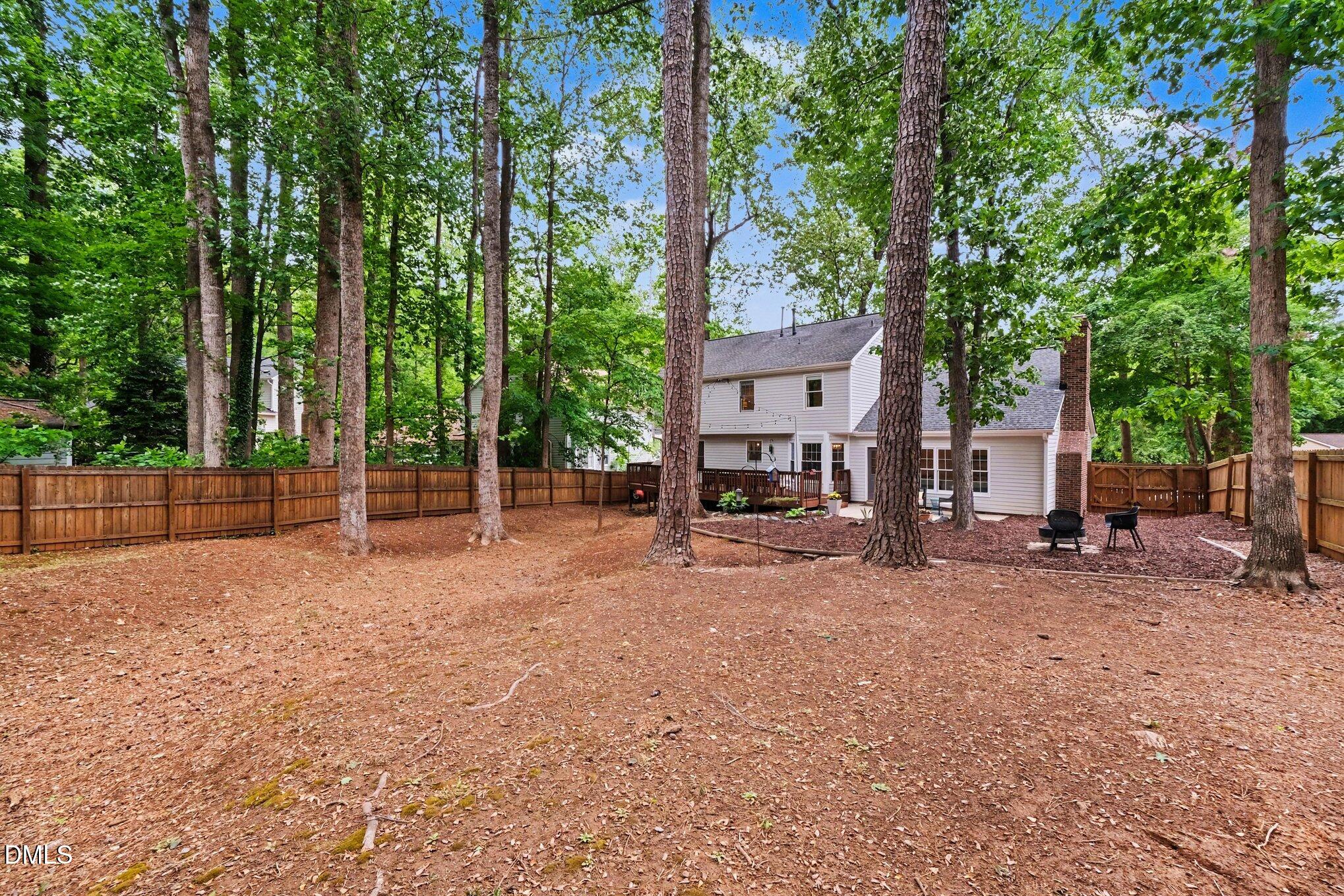 103 Leckford Way Cary, NC 27513 - Photo 38 of 49 a view of a house with backyard and a tree