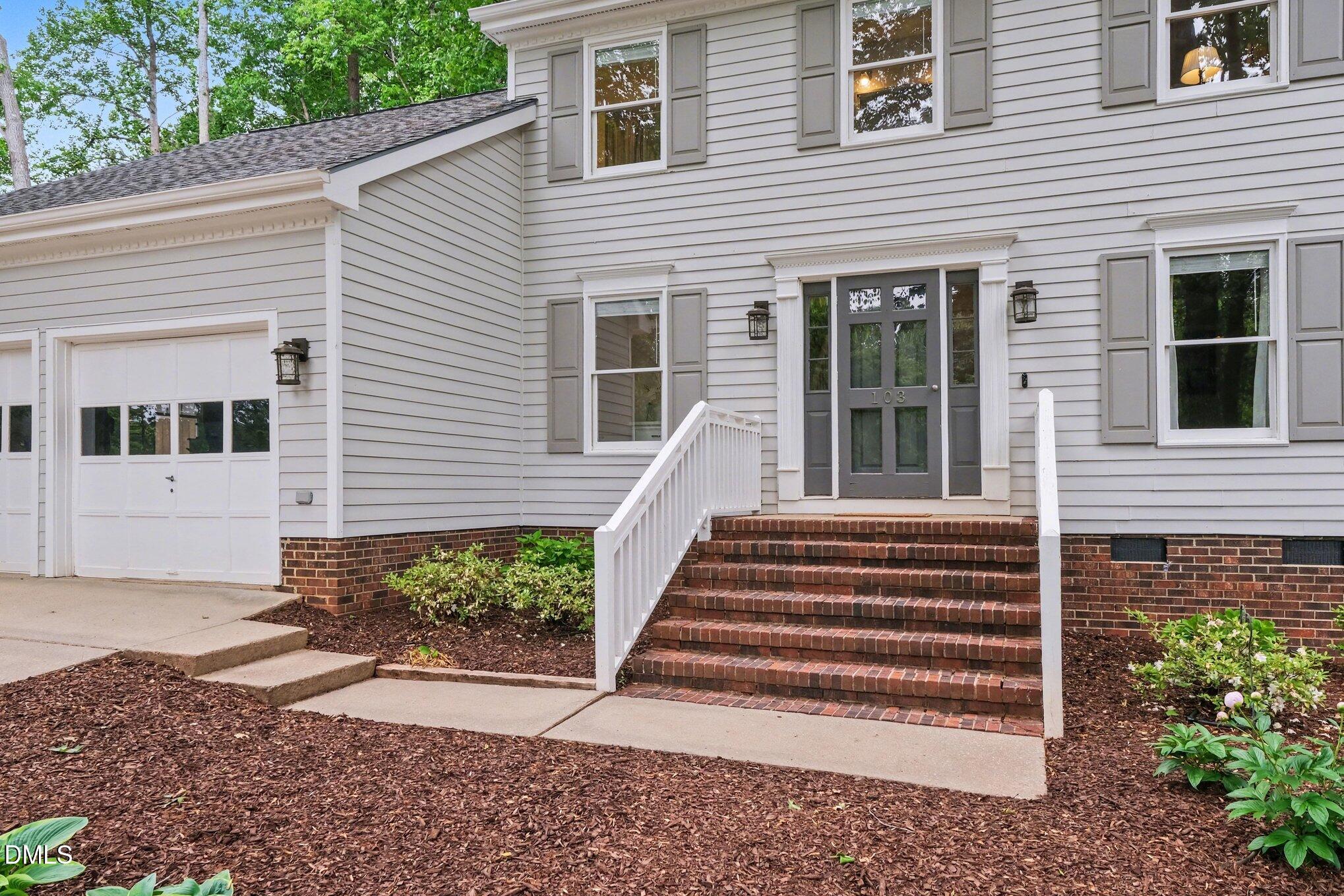 103 Leckford Way Cary, NC 27513 - Photo 4 of 49 a view of a house with a window and a yard