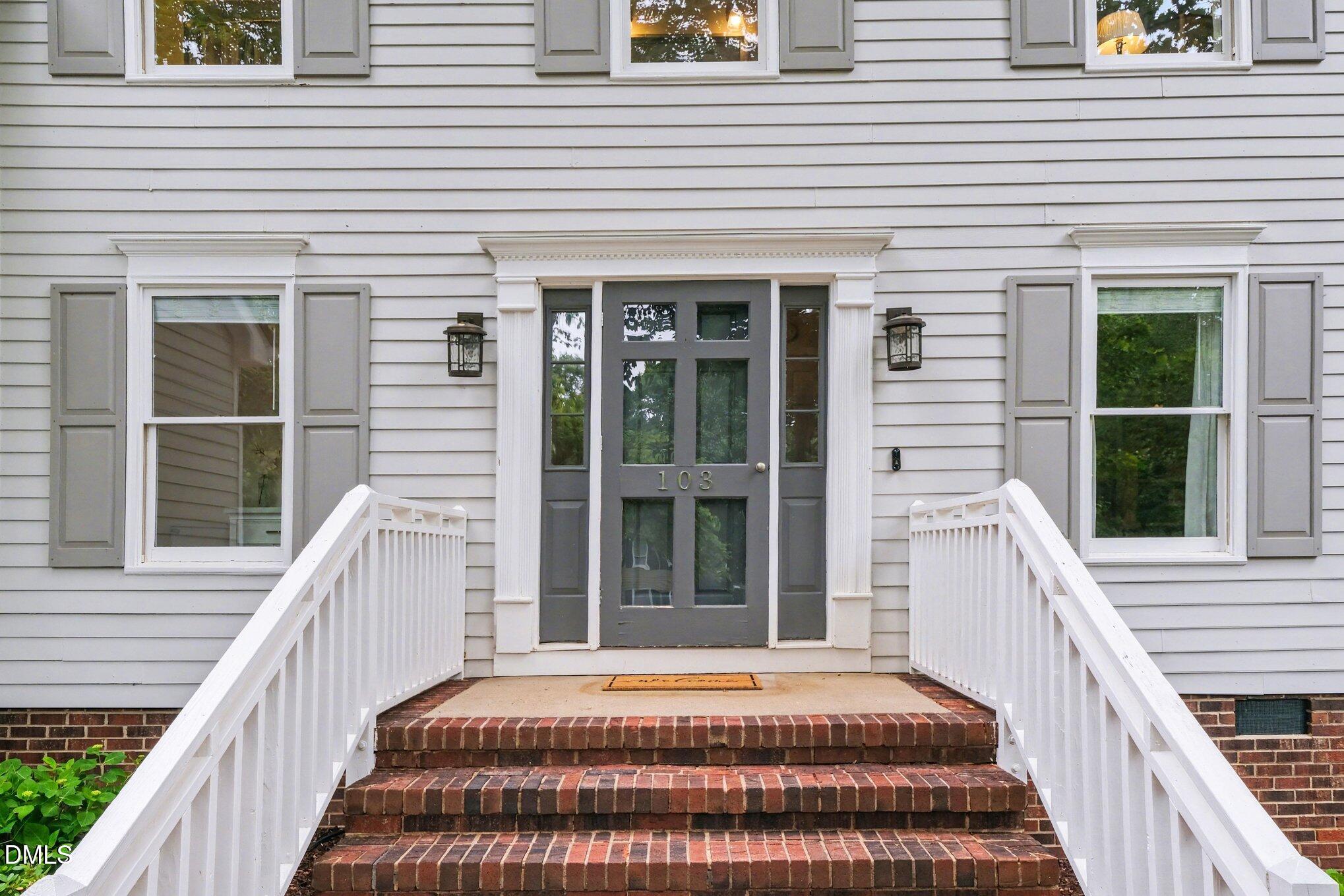 103 Leckford Way Cary, NC 27513 - Photo 5 of 49 a front view of a house with a porch
