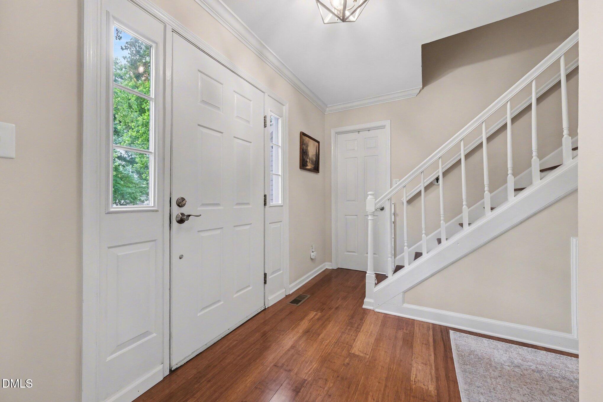 103 Leckford Way Cary, NC 27513 - Photo 6 of 49 a view of an entryway with wooden floor