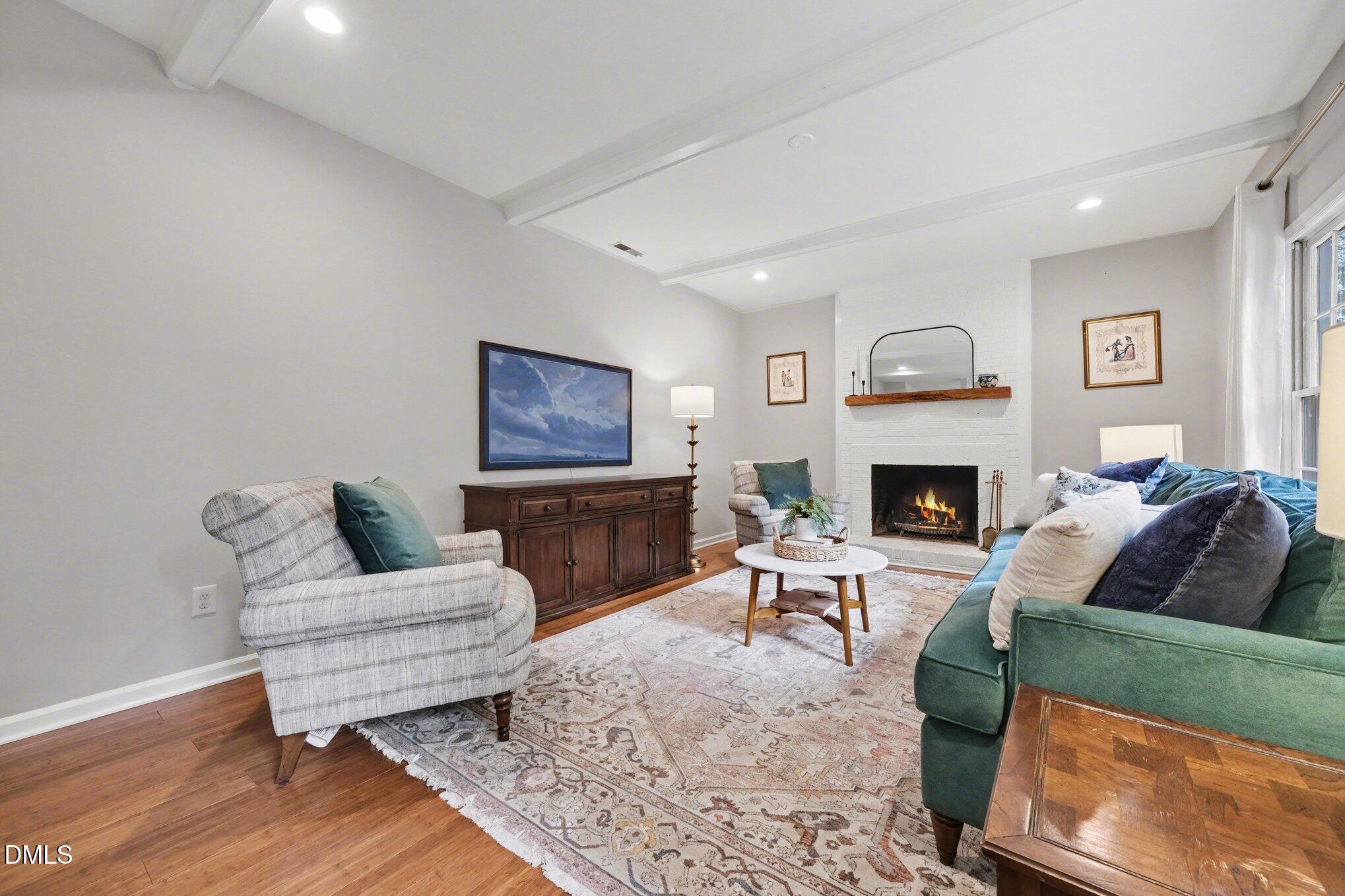 103 Leckford Way Cary, NC 27513 - Photo 7 of 49 a living room with furniture and a fireplace
