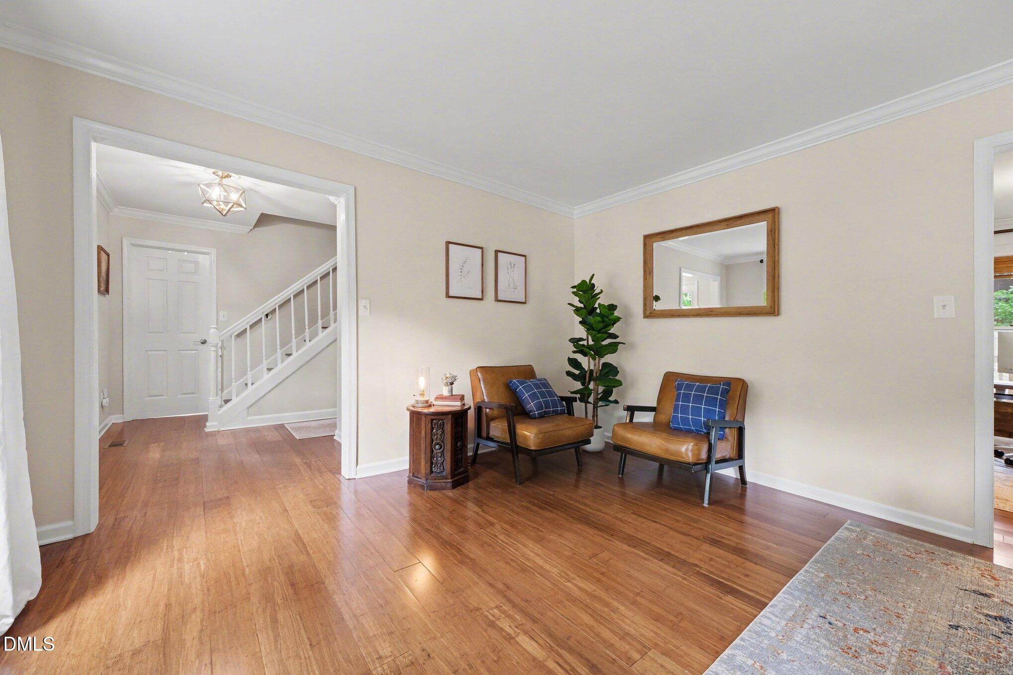 103 Leckford Way Cary, NC 27513 - Photo 9 of 49 a living room with furniture and a wooden floor