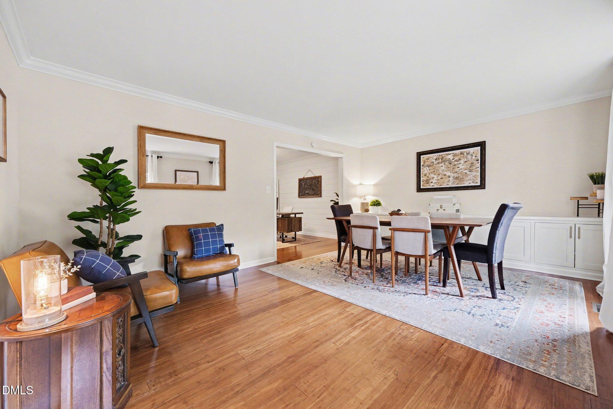 103 Leckford Way Cary, NC 27513 - Photo 10 of 49 a living room with furniture and a wooden floor