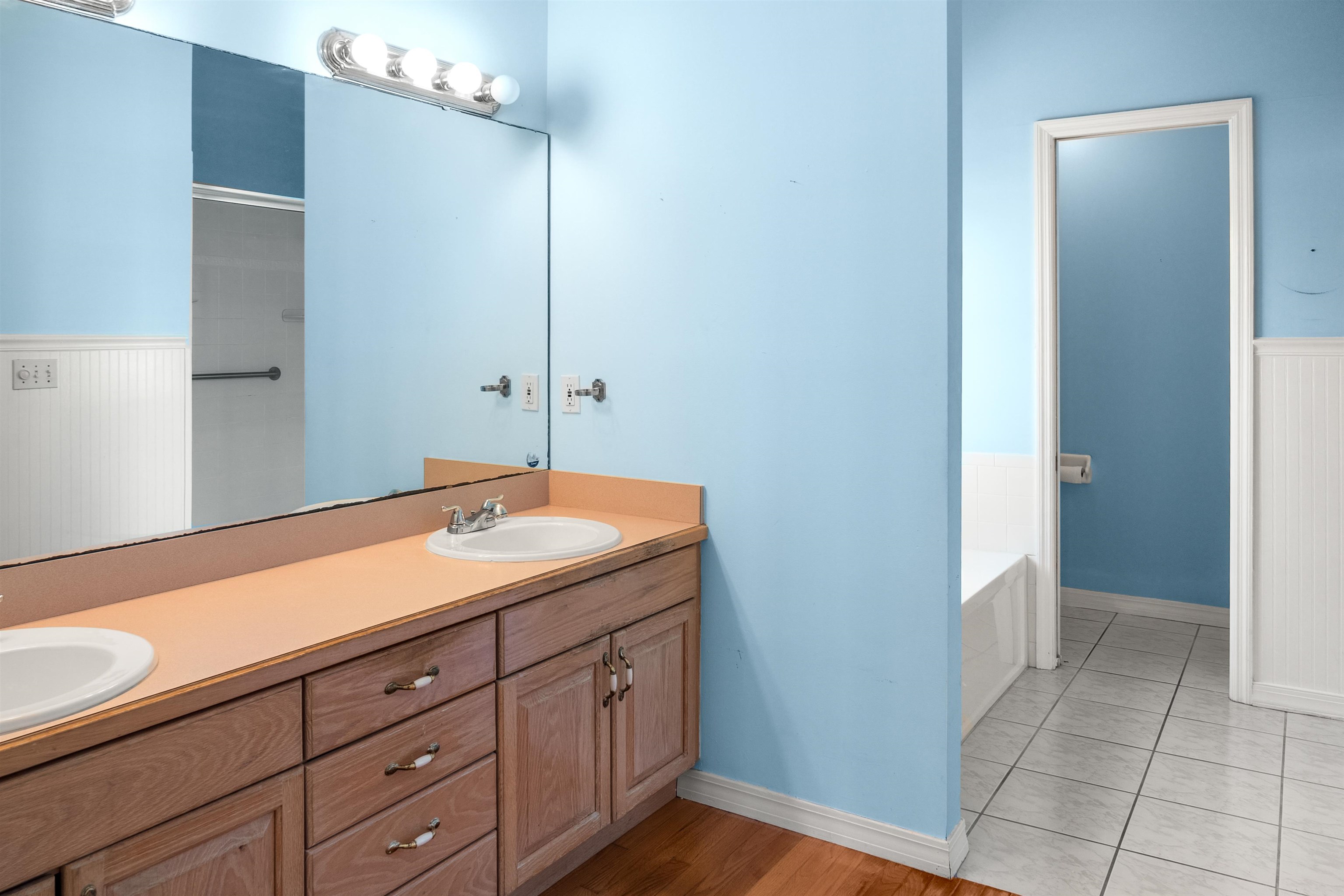 9277 July Lane St. Augustine, FL 32080 - Photo 41 of 72 a bathroom with a sink and a mirror