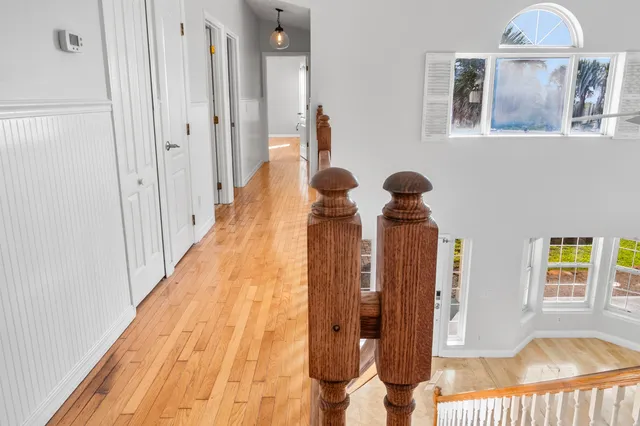 a front view of a house with garden and sitting area