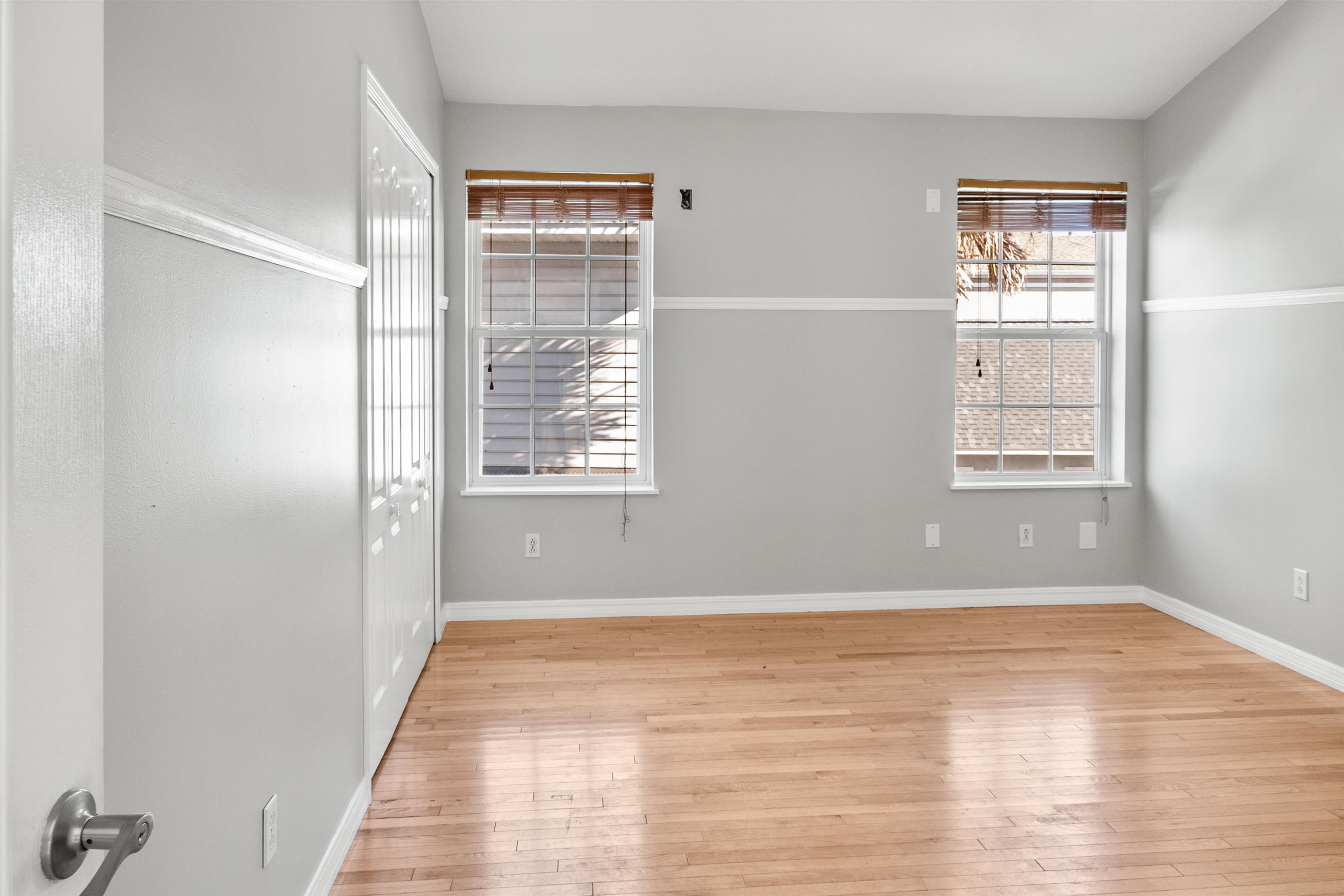 9277 July Lane St. Augustine, FL 32080 - Photo 46 of 72 a view of an empty room with wooden floor and a window