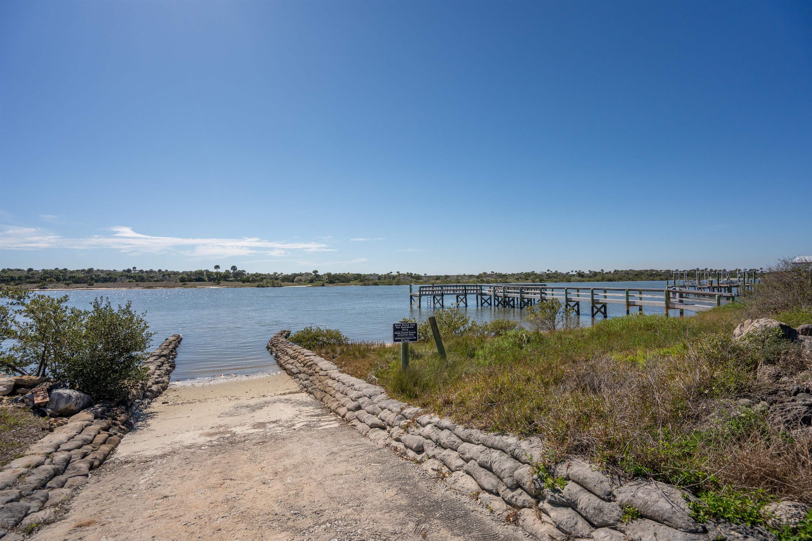 9277 July Lane St. Augustine, FL 32080 - Photo 68 of 72 a view of a lake with a mountain in the background