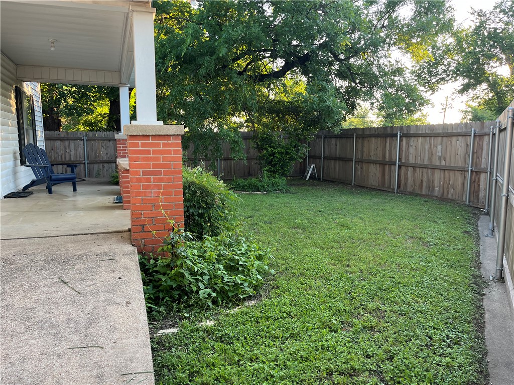 1102 North Travis Avenue Cameron, TX 76520 - Photo 2 of 48 View of fenced backyard