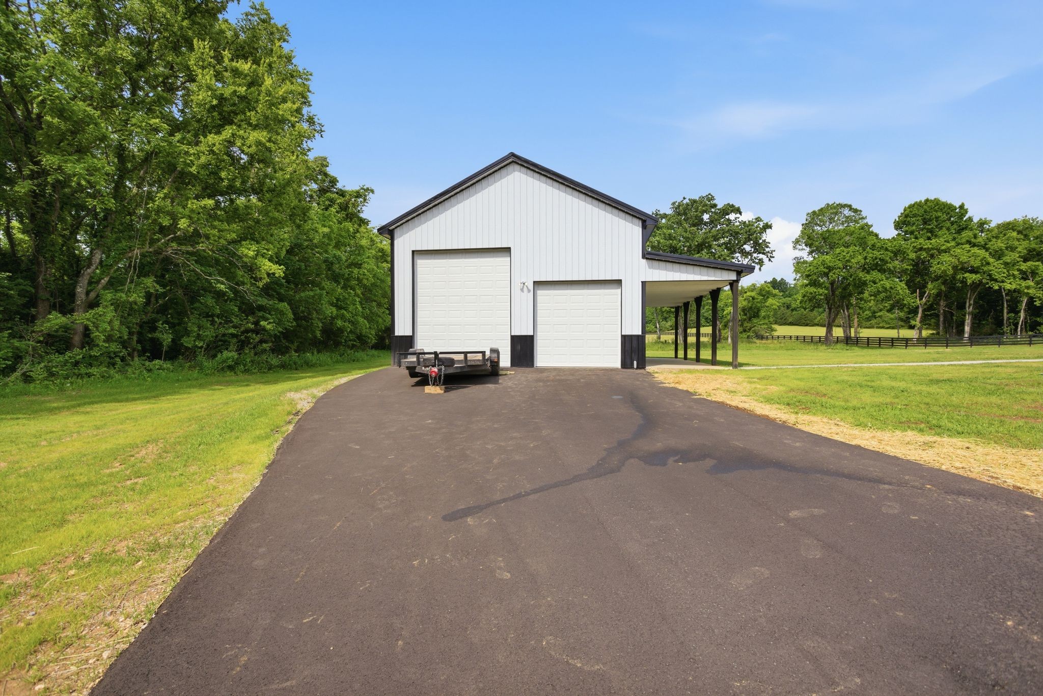 3319 Booker Ridge Road Mount Pleasant, TN 38474 - Photo 51 of 51 a view of a house with a yard and garage
