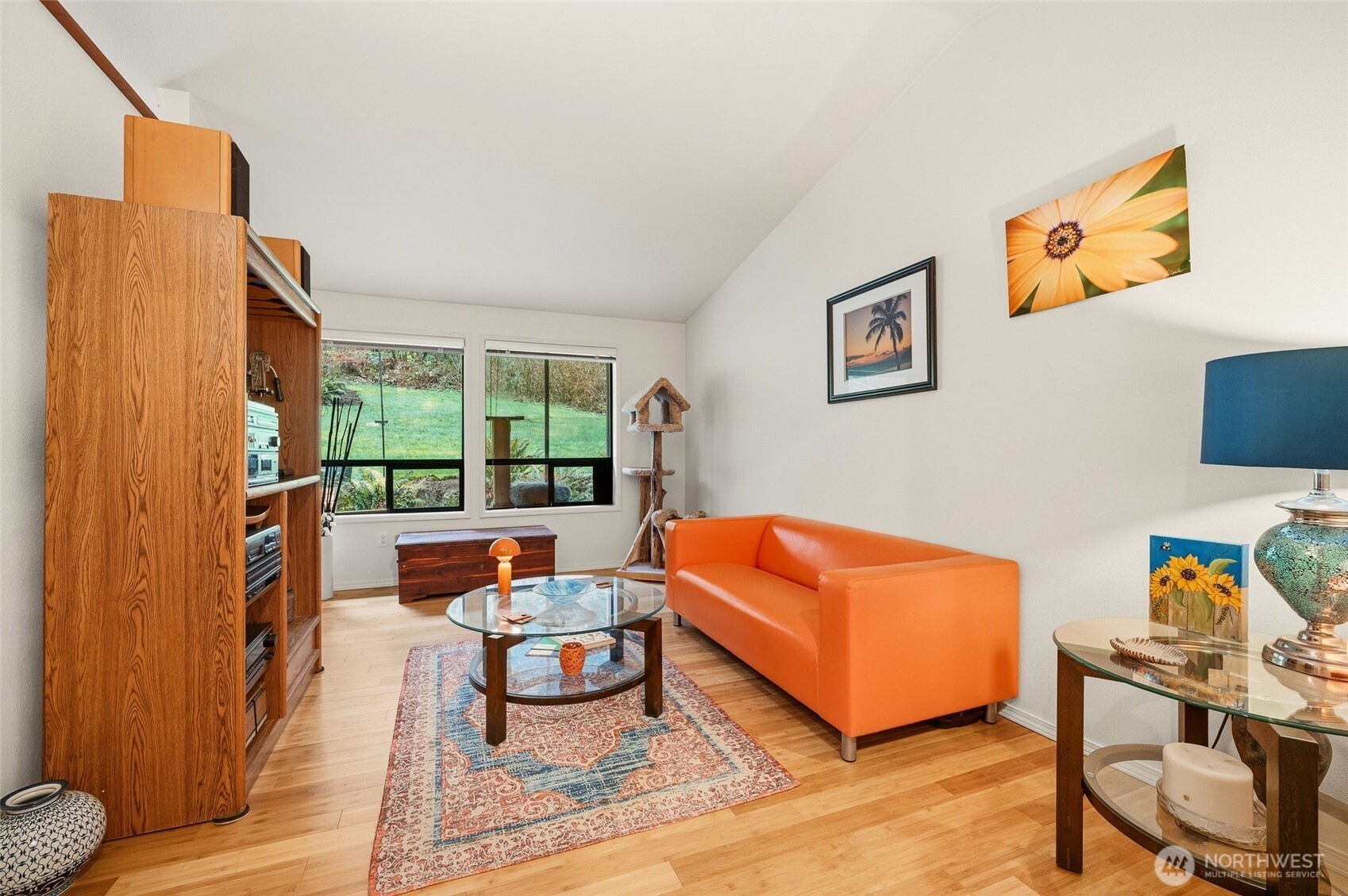 6830 Norma Beach Road Edmonds, WA 98026 - Photo 10 of 30 a living room with furniture a rug and a window