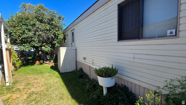 1500 Angel Street North, Unit 53 Layton, UT 84041 - Photo 14 of 20 Exterior siding in a light neutral tone featuring a large window with blinds and a screen