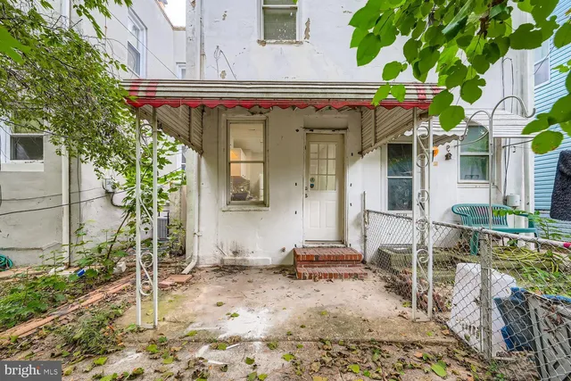 a view of a chairs and table in the patio