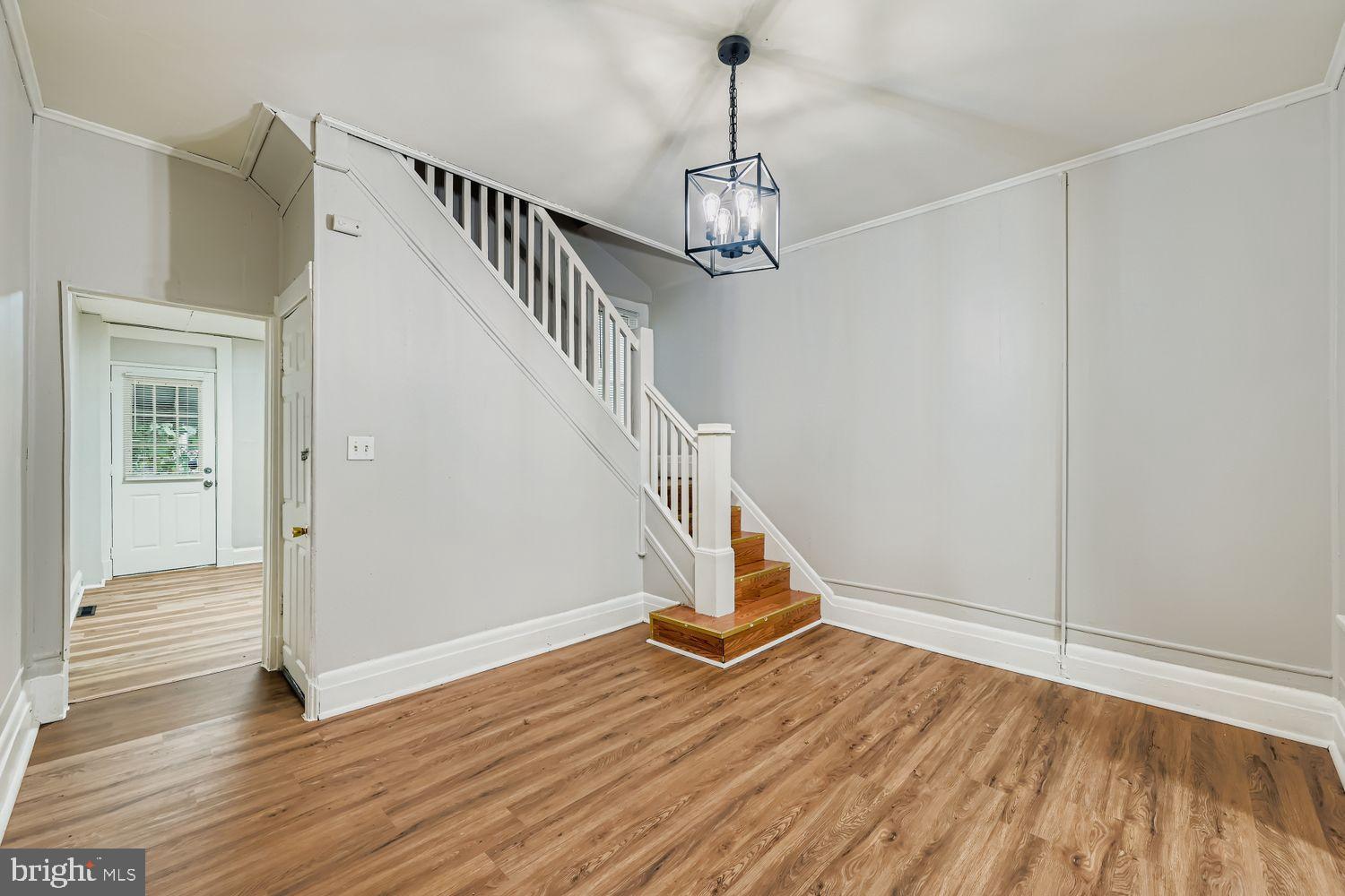 415 Cambria Street Baltimore, MD 21225 - Photo 5 of 17 a view of an entryway with wooden floor