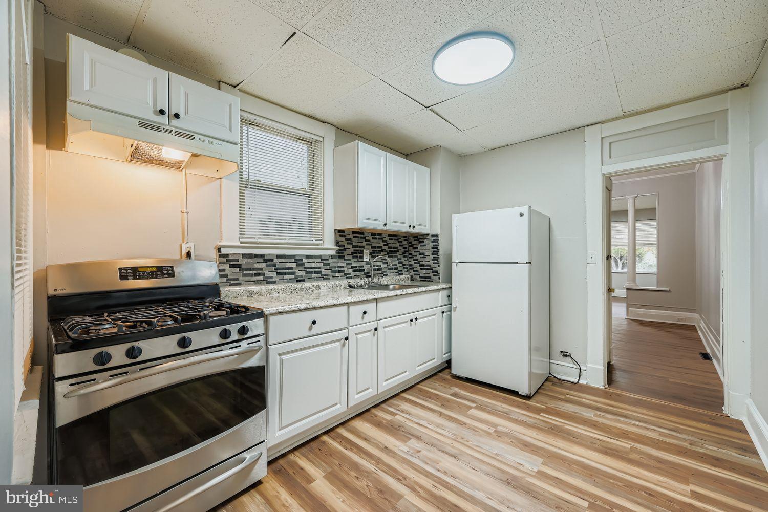 415 Cambria Street Baltimore, MD 21225 - Photo 6 of 17 a kitchen with cabinets appliances and a counter space