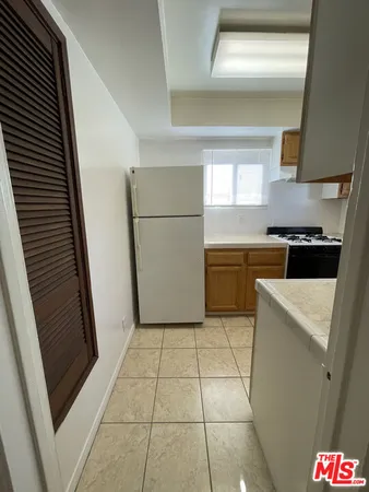 a kitchen with a stove a refrigerator a sink and dishwasher
