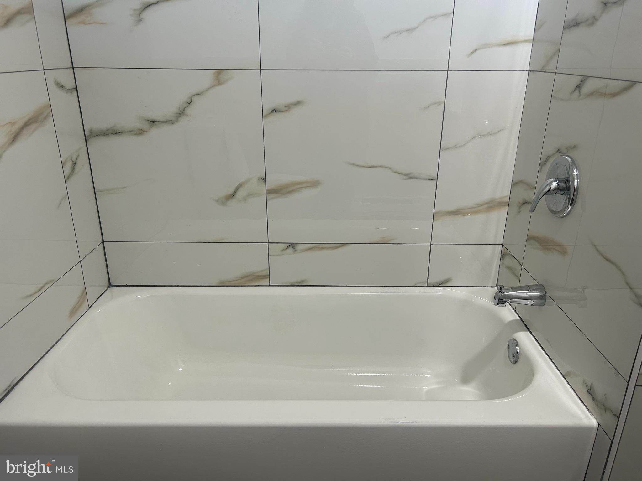 222 West Patterson Street, Unit 2 Lansford, PA 18232 - Photo 12 of 16 a bathroom with a bathtub