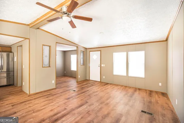 a kitchen with stainless steel appliances granite countertop a stove and a refrigerator