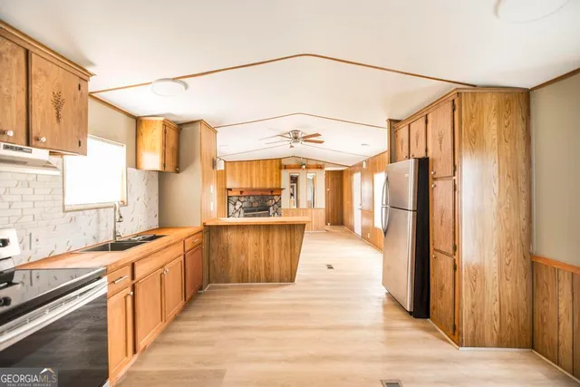 a view of an empty room and a window