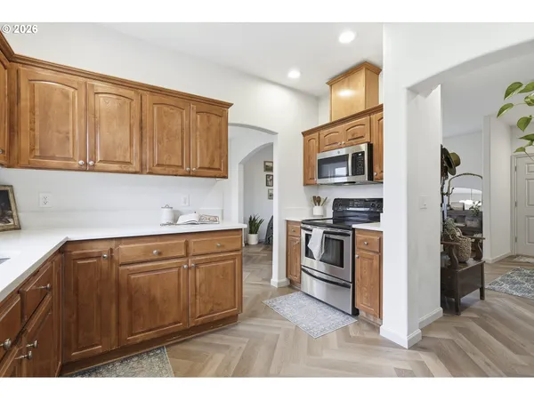 a kitchen with stainless steel appliances granite countertop a stove and a sink