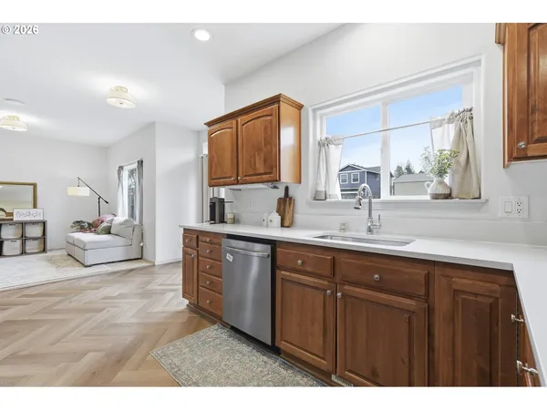 a spacious bathroom with a sink double vanity granite and a mirror
