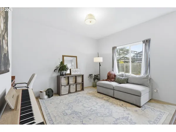 a living room with furniture and a window