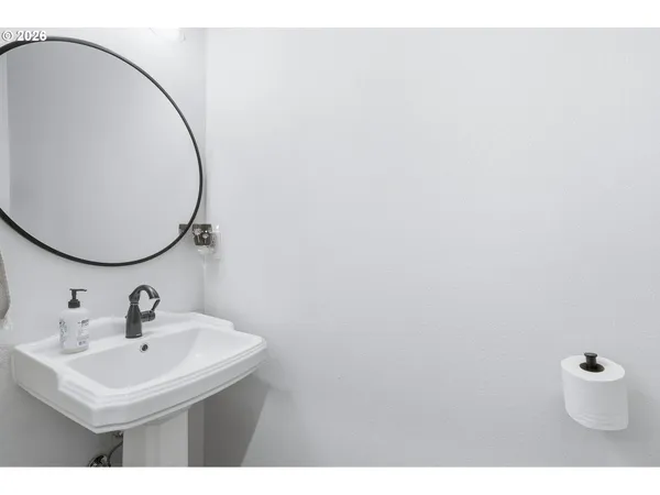 a bathroom with a sink a mirror and a toilet