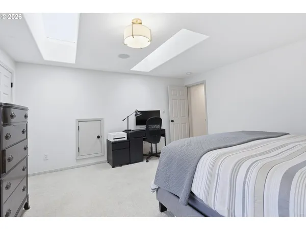 a bedroom with a bed and with furniture