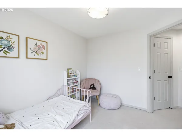 a bedroom with a bed and cabinets
