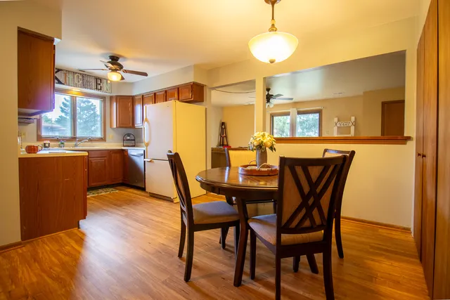 a dining room with furniture and window