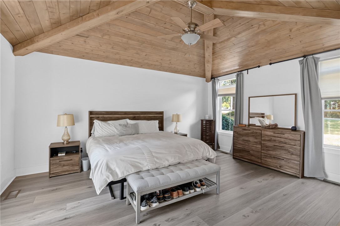 1504 Double Springs Road Townville, SC 29689 - Photo 17 of 49 A striking vaulted wood ceiling brings natural warmth to this light-filled main bedroom.