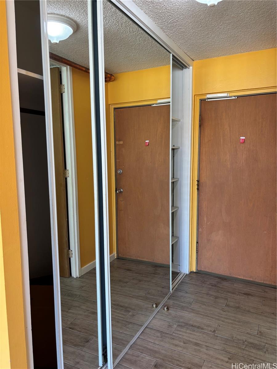 1650 Kanunu Street, Unit 1316 Honolulu, HI 96814 - Photo 2 of 5 a view of a bathroom with a glass door