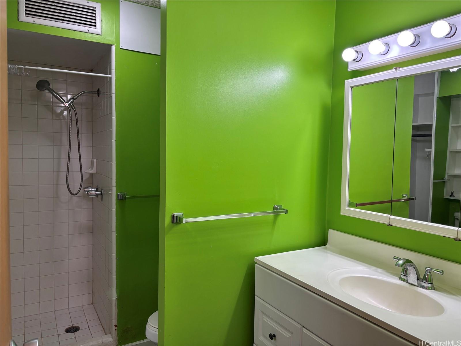 1650 Kanunu Street, Unit 1316 Honolulu, HI 96814 - Photo 5 of 5 a bathroom with a sink a toilet and shower