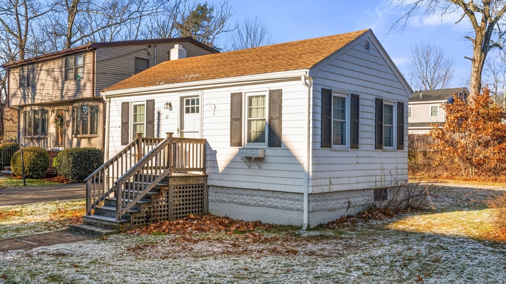 69 Hastings Road Dedham, MA 02026 - Photo 3 of 11 a view of a house with a yard