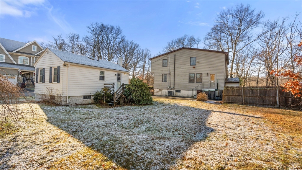 69 Hastings Road Dedham, MA 02026 - Photo 7 of 11 a front view of a house with garden