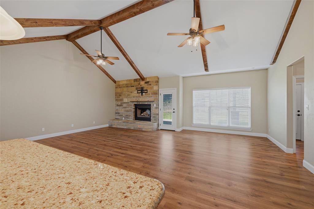 785 Schneider Road Howe, TX 75459 - Photo 11 of 40 a view of empty room with wooden floor fan and window