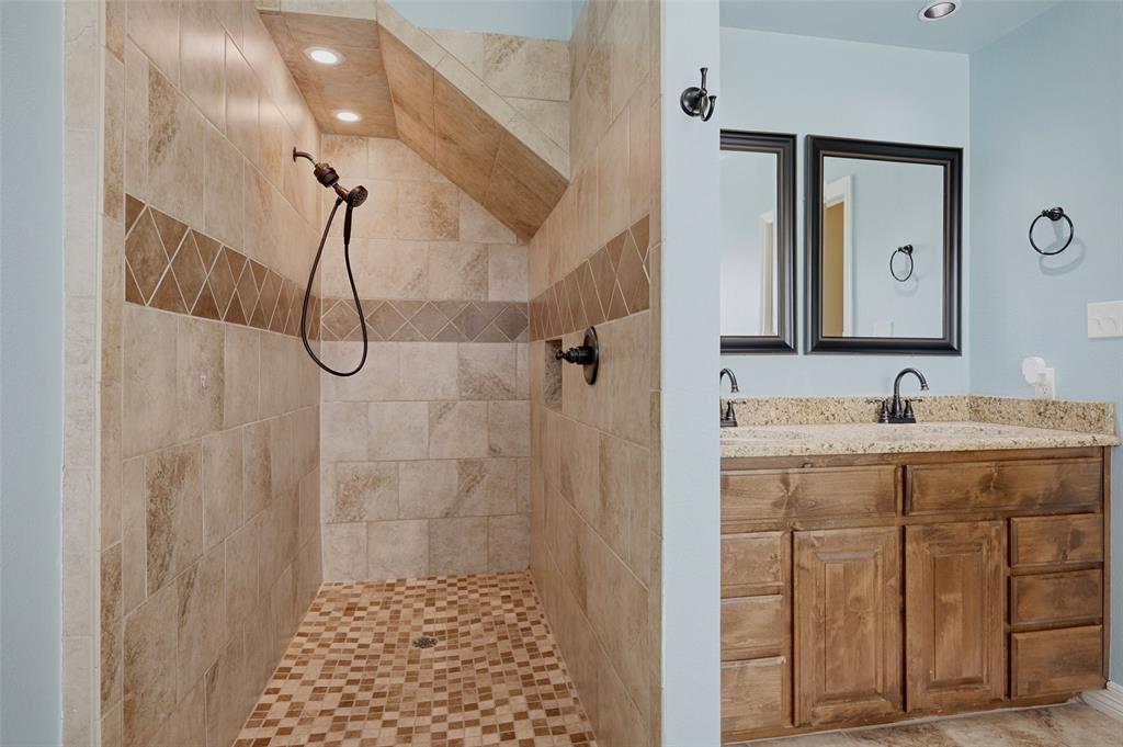 785 Schneider Road Howe, TX 75459 - Photo 20 of 40 a bathroom with a shower sink and mirror