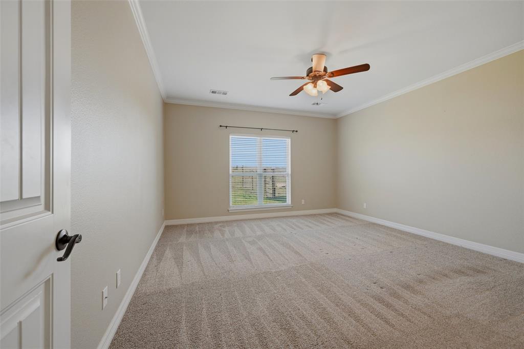 785 Schneider Road Howe, TX 75459 - Photo 23 of 40 an empty room with windows and fan