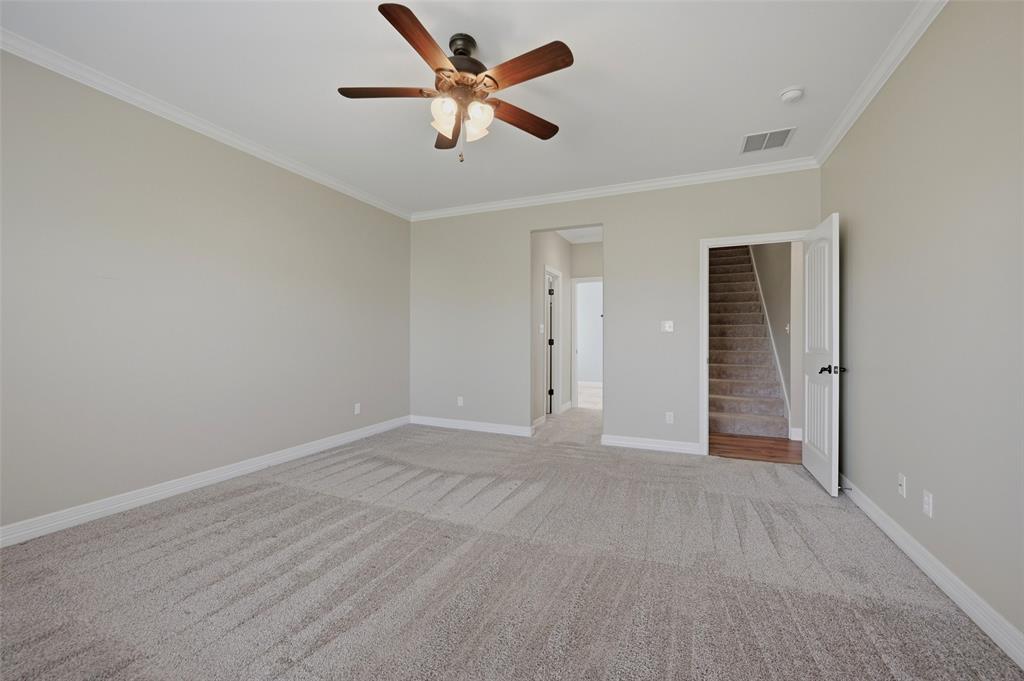 785 Schneider Road Howe, TX 75459 - Photo 24 of 40 an empty room with closet and a ceiling fan