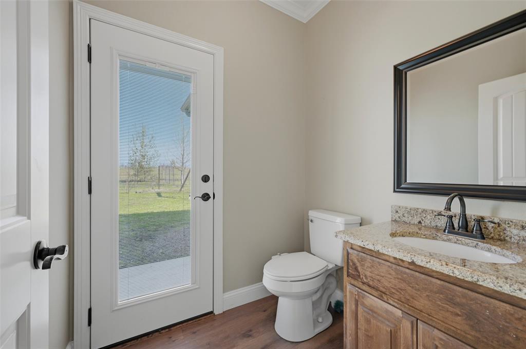 785 Schneider Road Howe, TX 75459 - Photo 28 of 40 a bathroom with a granite countertop sink toilet and shower