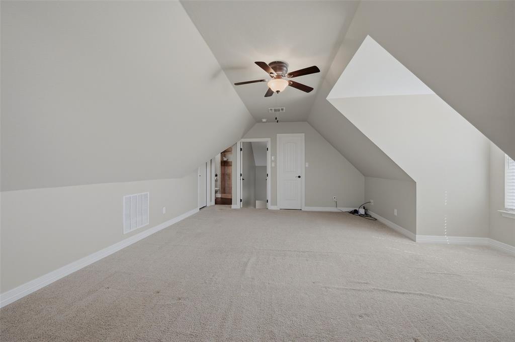 785 Schneider Road Howe, TX 75459 - Photo 30 of 40 an empty room with a ceiling fan and carpet