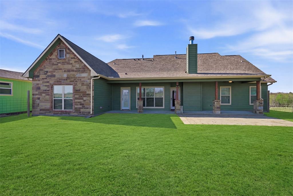 785 Schneider Road Howe, TX 75459 - Photo 34 of 40 a front view of a house with a garden