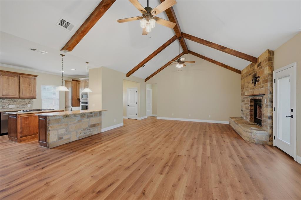 785 Schneider Road Howe, TX 75459 - Photo 6 of 40 a view of kitchen and hall with wooden floor