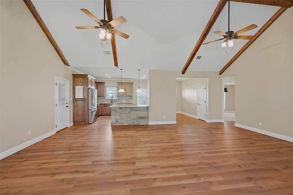 785 Schneider Road Howe, TX 75459 - Photo 10 of 40 a view of empty room with wooden floor and fan