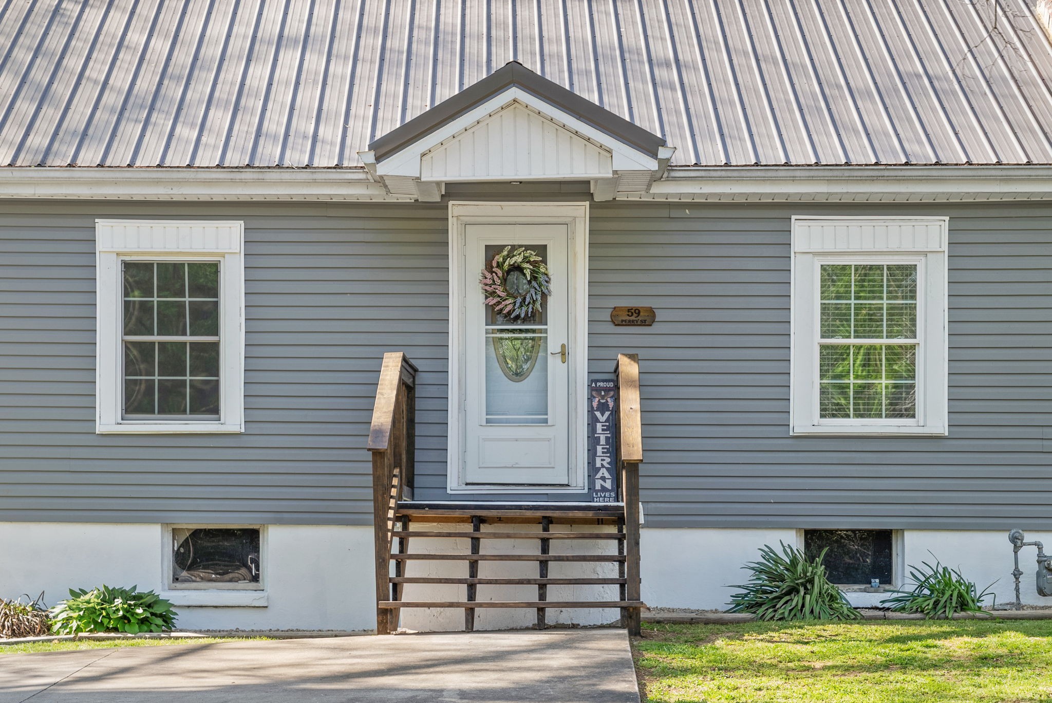 59 Perry Street Cadiz, KY 42211 - Photo 2 of 32 a view of a house with a yard and plants
